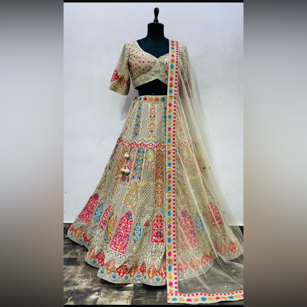 Temple embroidery golden net bridal Lehenga Choli with Dupatta.